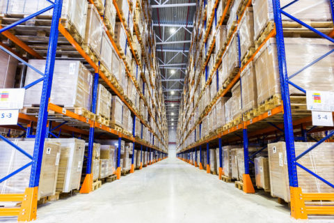 55748040 - rows of shelves with boxes in modern warehouse